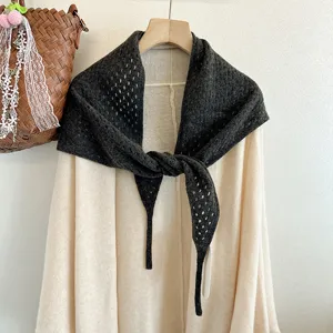 Dark gray wool hollow knit triangle scarf detail shot, cozy winter knitwear shawl