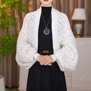 Detail shot of women white knit cardigan, hollow out diamond pattern batwing sleeve sweater top.