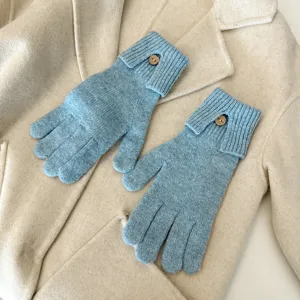 Knitted touch screen gloves detail, solid light blue warm winter gloves with wood button.
