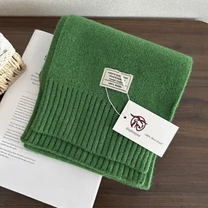 Solid color knitted wool scarf for women and men, warm winter scarf, premium cozy accessory.