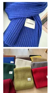 Detailed view of the thick knitted winter scarf texture and color variants display clearly.