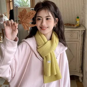 Cozy yellow knitted wool scarf for autumn and winter, warm and stylish daily wear accessory.