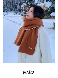 Cozy wool-blend winter scarf with elegant contrast stitching for women and men, soft and warm.