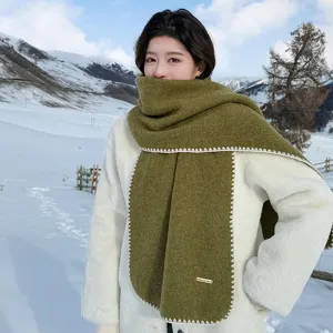 Cozy wool-blend winter scarf with blanket stitch edge for women, warm and stylish daily wear.
