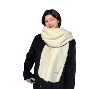 Cozy wool-blend winter scarf with stylish contrast black lock-stitch edge for women and men.