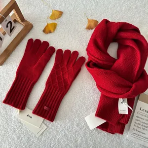 Red wool knitted scarf and gloves set for winter warmth, elegant couple cold weather accessories.