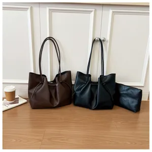 Detailed view of large capacity PU leather tote bag set with strap knots for daily commute.