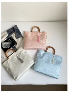 Chinesischer Stil Stoff Handtasche mit Bambusgriff und eleganter Quaste Mode Detailansicht