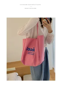 Detail view of casual pink canvas tote bag, large capacity shoulder shopping bag for daily wear.