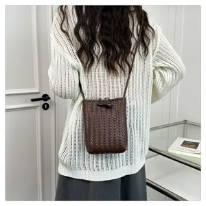 Woven PU leather crossbody phone bag with toggle closure, chic minimalist shoulder bag for women.
