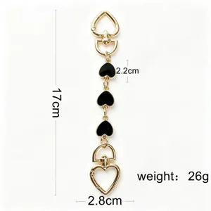 Black enamel heart bag chain detail showing length 17cm and weight 26g metal keychain.