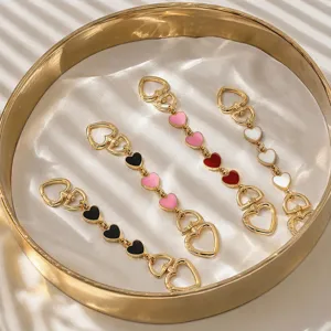 Fashion metal heart keychain and bag charm set with oil drop design, elegant accessories.