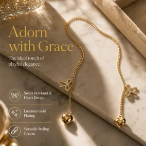Exquisite metal chain with rhinestone bowknot and heart pendant, stylish detail view.