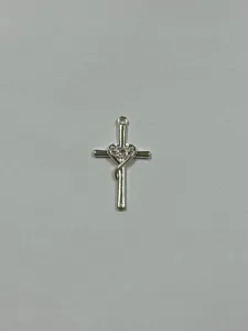 Silver cross pendant detail view featuring intertwined heart and sparkling cubic zirconia.