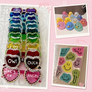 DIY rhinestone craft detail showing sparkly crystal sunglasses, duck figurines and smiley art.