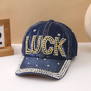 Berretto da baseball in denim blu con lettere LUCK in strass e visiera borchiata donna