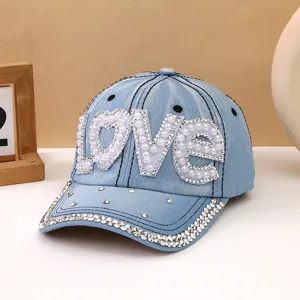 Cappellino da baseball in denim azzurro con lettere LOVE in strass e visiera scintillante.
