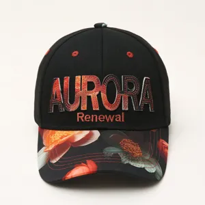 Close-up of black baseball cap front, featuring embroidered Aurora letters and floral print brim.