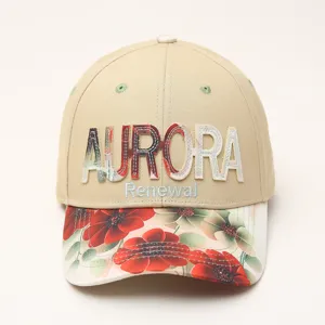 Detail view of stylish beige baseball cap featuring floral brim and Aurora embroidery.