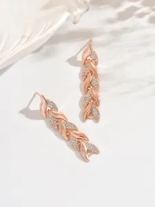 Exquisite rose gold rhinestone leaf dangle earrings detail, showcasing shimmering crystal stones.