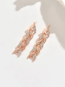 Exquisite rose gold leaf rhinestone dangling earrings, detailed crystal pavé drop design.