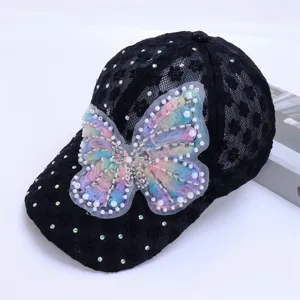 Black lace baseball cap with sparkling rhinestones and a stunning colorful pearl mesh butterfly.