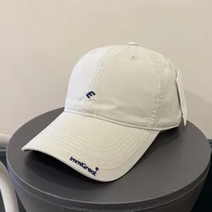 Minimalist embroidered baseball cap for women and men, casual streetwear sun hat.