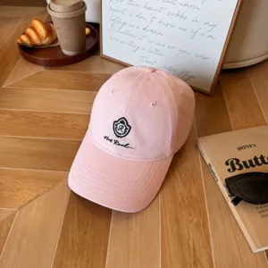 Pink cotton baseball cap with embroidered logo, stylish casual hat for women and daily outdoor wear.