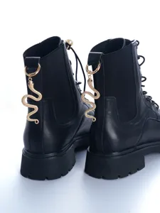 Punk style black leather Martin boots with detachable gold snake charm and back pull tab details.
