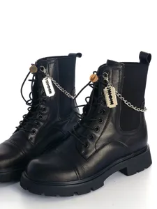 Gothic black leather combat boots with cool chain and razor blade pendant for edgy punk styles.