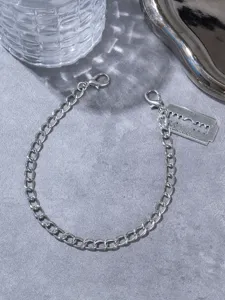 Gothic style metal razor blade pendant chain shoe accessory for trendy boots and fashion.