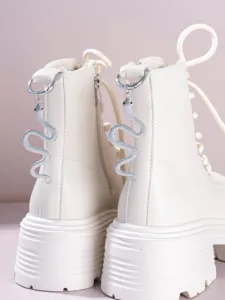 Gothic vintage Martin boots with snake pendant heel charm off-white platform detail view