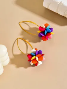 Colorful acrylic flower petal earrings closeup showing vibrant candy colored bead clusters on gold hooks.