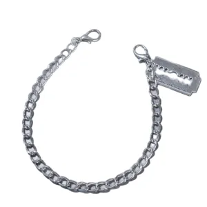 Gothic punk metal boot chain shoe accessory with razor blade pendant for men and women fashion.