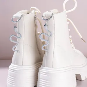 Gothic white chunky platform Martin boots featuring stylish silver snake pendant heel accessories.