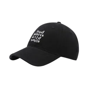 Close-up detail of black washed baseball cap with white embroidered lettering design.