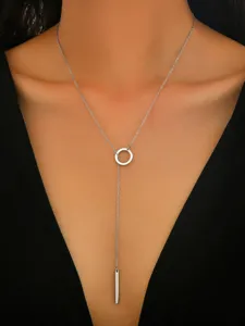 Minimalist silver stainless steel lariat necklace close-up, delicate chain with ring and bar.