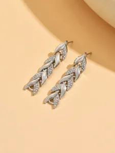 Close-up detail view of the silver rhinestone leaf dangle earrings showcasing exquisite craft.