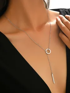 Close-up detail of minimalist silver lariat necklace featuring a circle ring and rectangular bar.