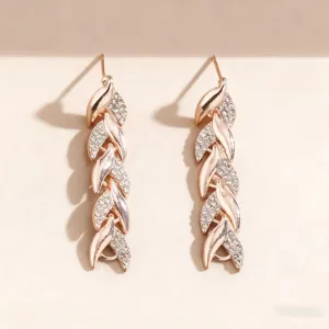 Elegant rose gold leaf dangling earrings featuring sparkling pave rhinestones for women.