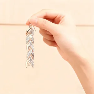 Luxury long rhinestone leaf dangle earrings, elegant rose gold plated fashion party jewelry.