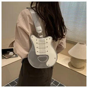 Creative guitar shaped shoulder bag with cool silver and white patchwork design.