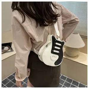 Creative guitar shape shoulder bag for women, stylish black and white patchwork design.