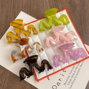 Detailed shot of colorful acetate hair claw clips set, small size shark clips for women