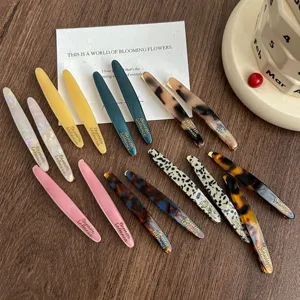 Acetate hair barrettes set with gold letters, stylish tortoise shell side clips for women hair.
