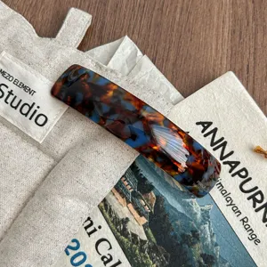 Tortoiseshell acetate hair clip detail shot, showing smooth texture and exquisite handmade finish.