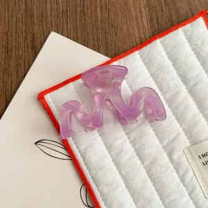 Purple acetate hair claw clip, elegant wave design, small shark hair clip for styling.
