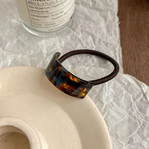 Elegant acetate curved hair tie with golden lettering, retro vintage ponytail hair rope.