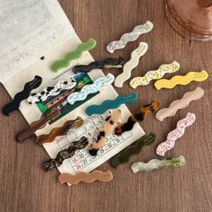 Acetate wavy hair clips detail view, stylish geometric barrettes for women hair styling.