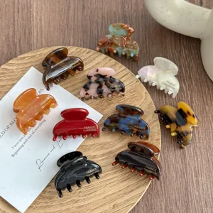 Small acetate hair claw clips set, colorful leopard print and mother-of-pearl design for styling.